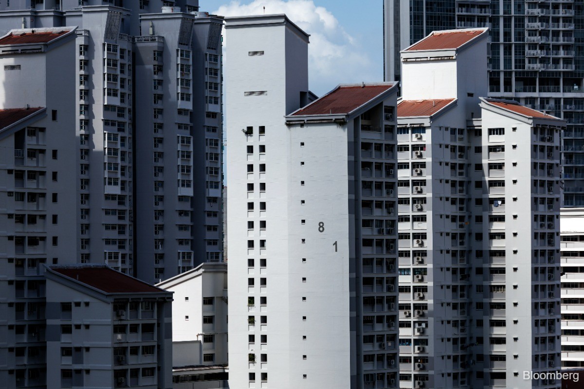 Singapore home sales drop; developer shares fall on war fears