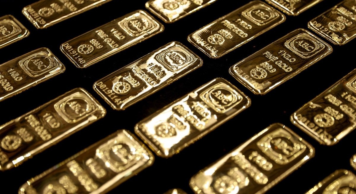 Gold holds close to record as demand for precious metals surges