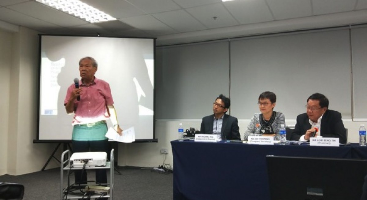 Caption: Minority shareholder Chew Ah Kong urges shareholders to vote against the proposed 1-cent per share dividend.