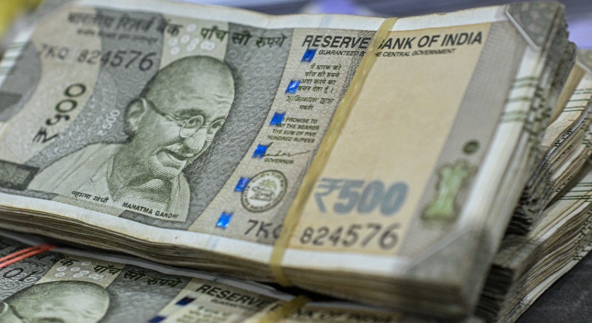 Indian rupee falls past 90 per dollar as trade stalemate weighs