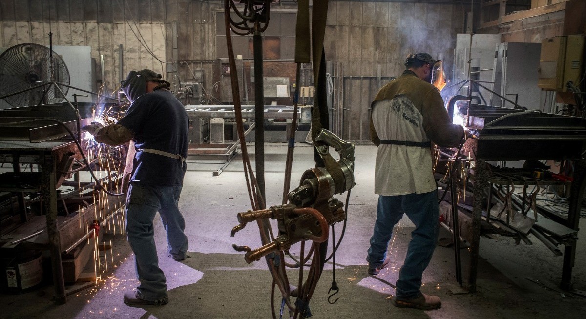 US manufacturing grew, input costs soared before Iran attack