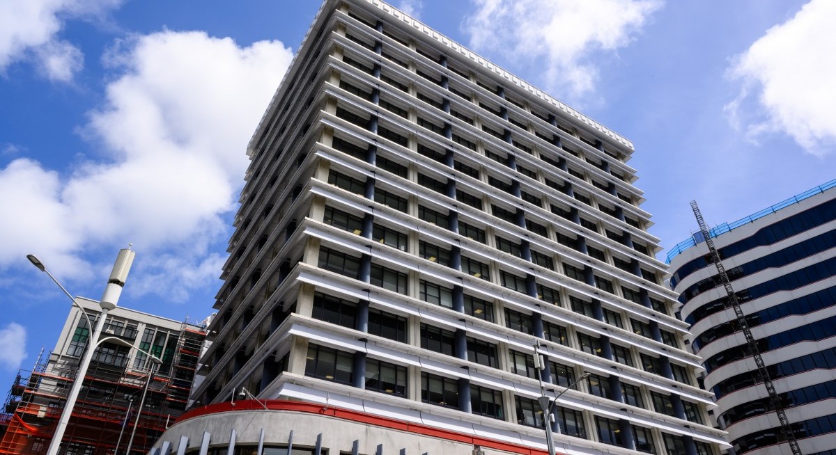 New Zealand's central bank cuts key rate, currency jumps on bets easing cycle near end