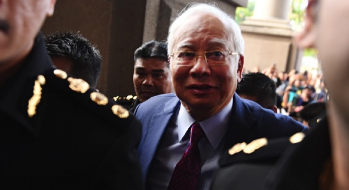 Najib charged with corruption, CBT in 1MDB case; apologises on Twitter but says not all accusations true