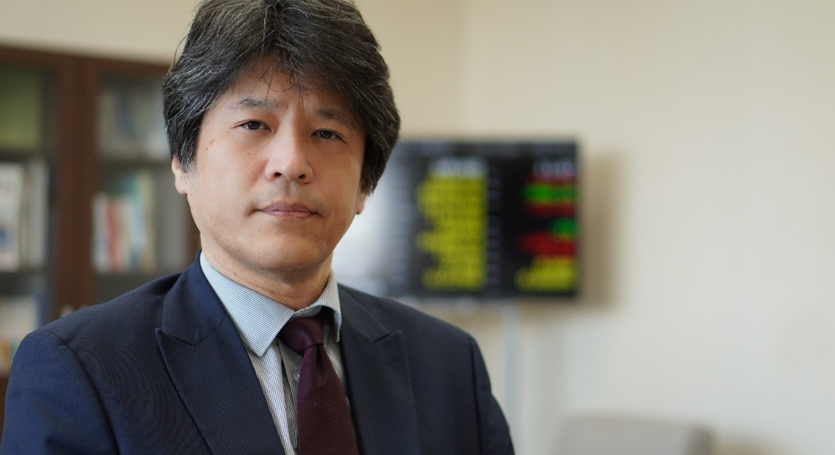 Japan regulator urges firms to use cash for growth, not returns