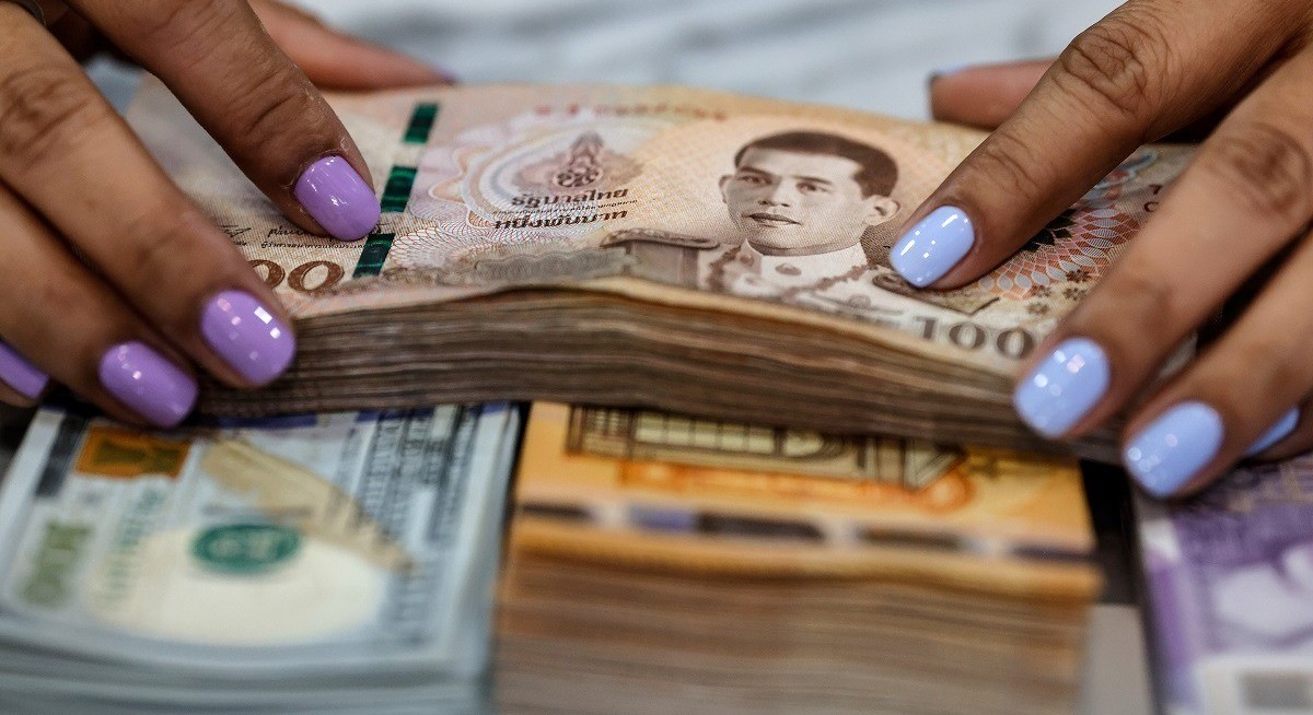 Thai baht war losses set to deepen on oil shock, strategists say